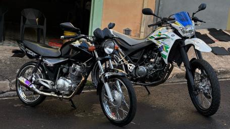 Stylish Motorcycles Displayed Together in Urban Setting wallpaper