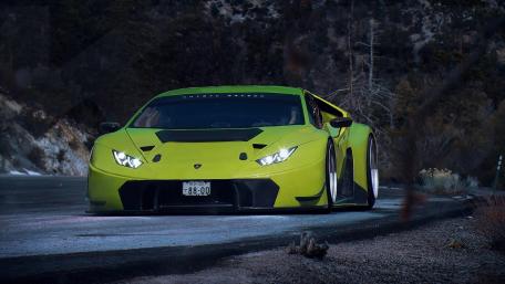 Low Slung Lamborghini Huracan on Dark Mountain Road wallpaper