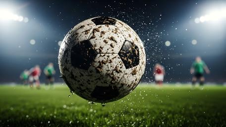 Dramatic Soccer Ball Under Stadium Lights wallpaper
