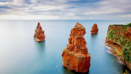 Ladram Bay Sea Stacks Under Soft Coastal Light wallpaper