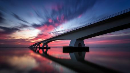 Zeelandbrug Sunset Over Tranquil Waters wallpaper