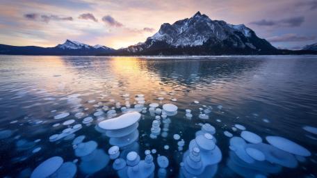 Frozen Bubbles Beneath Alberta Mountain Twilight wallpaper