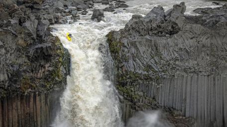 Daring Kayak Drop Through Thunderous Gorge wallpaper