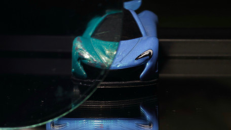 Glowing Toy Car Reflection wallpaper
