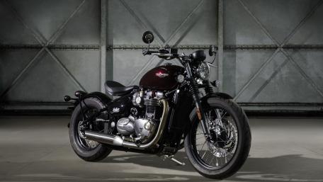 Classic Triumph Bonneville in Dark Garage wallpaper