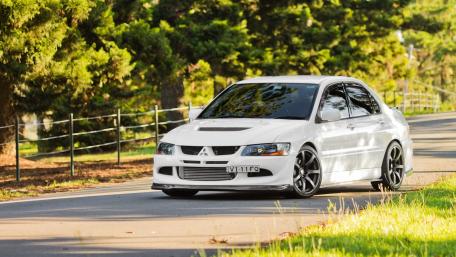 White Mitsubishi Lancer Evo on Scenic Road wallpaper