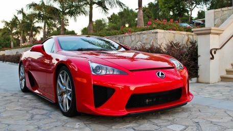 Red Lexus Sports Car in Tropical Driveway wallpaper