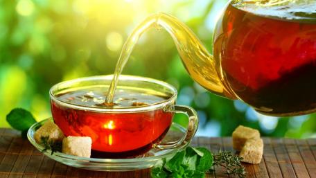 Golden Tea Pour wallpaper