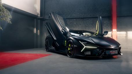 Matte Black Lamborghini Revuelto in Garage wallpaper
