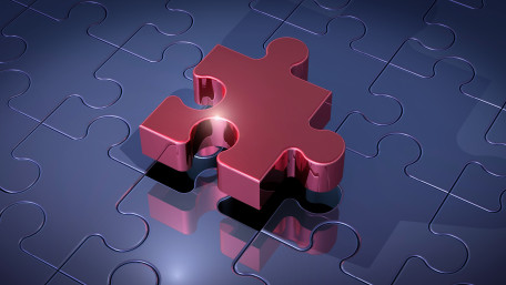 Glossy Puzzle Piece on Dark Surface wallpaper