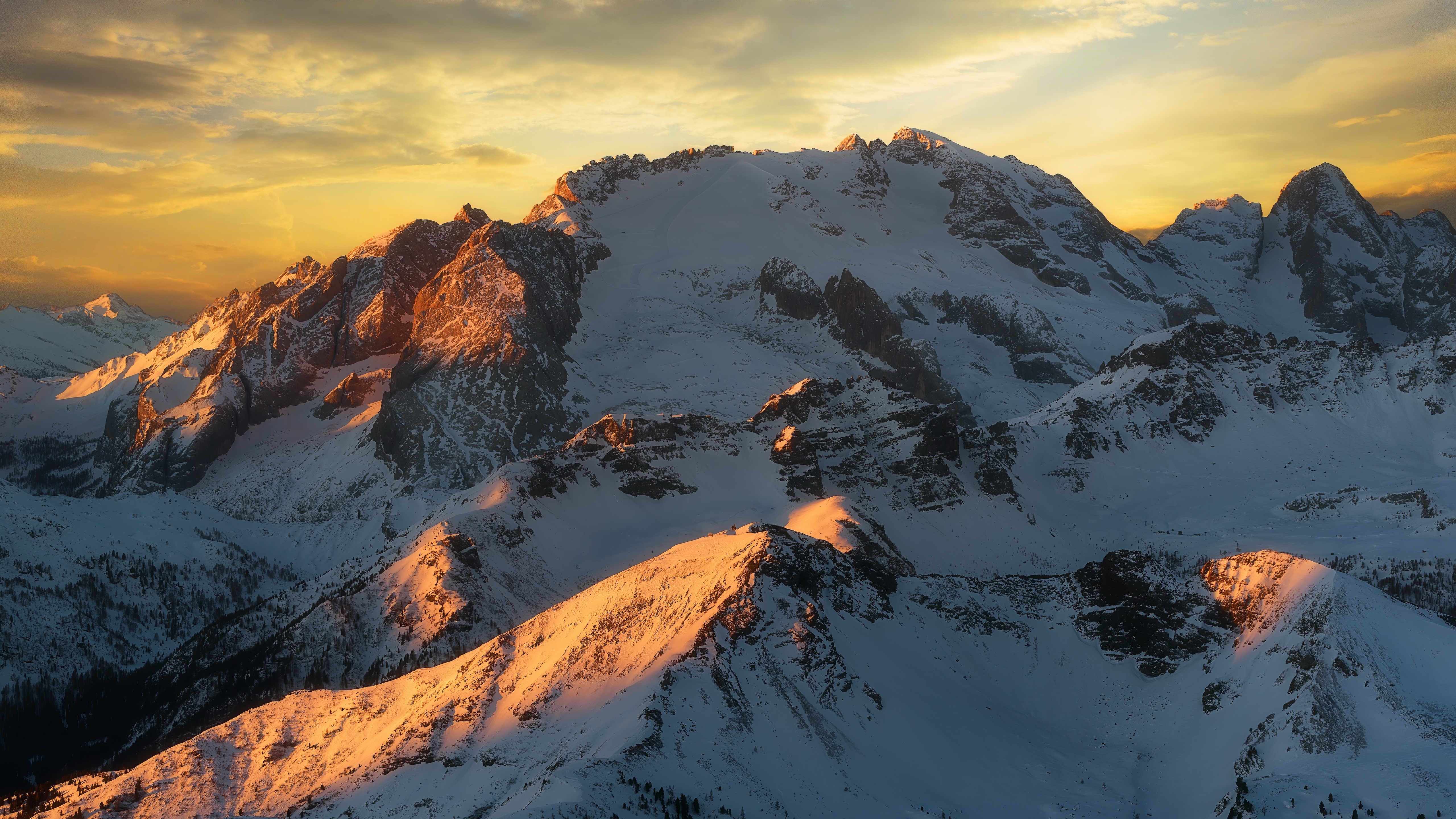 golden-sunset-over-snowy-piz-bo-summit-in-the-dolomites-backiee