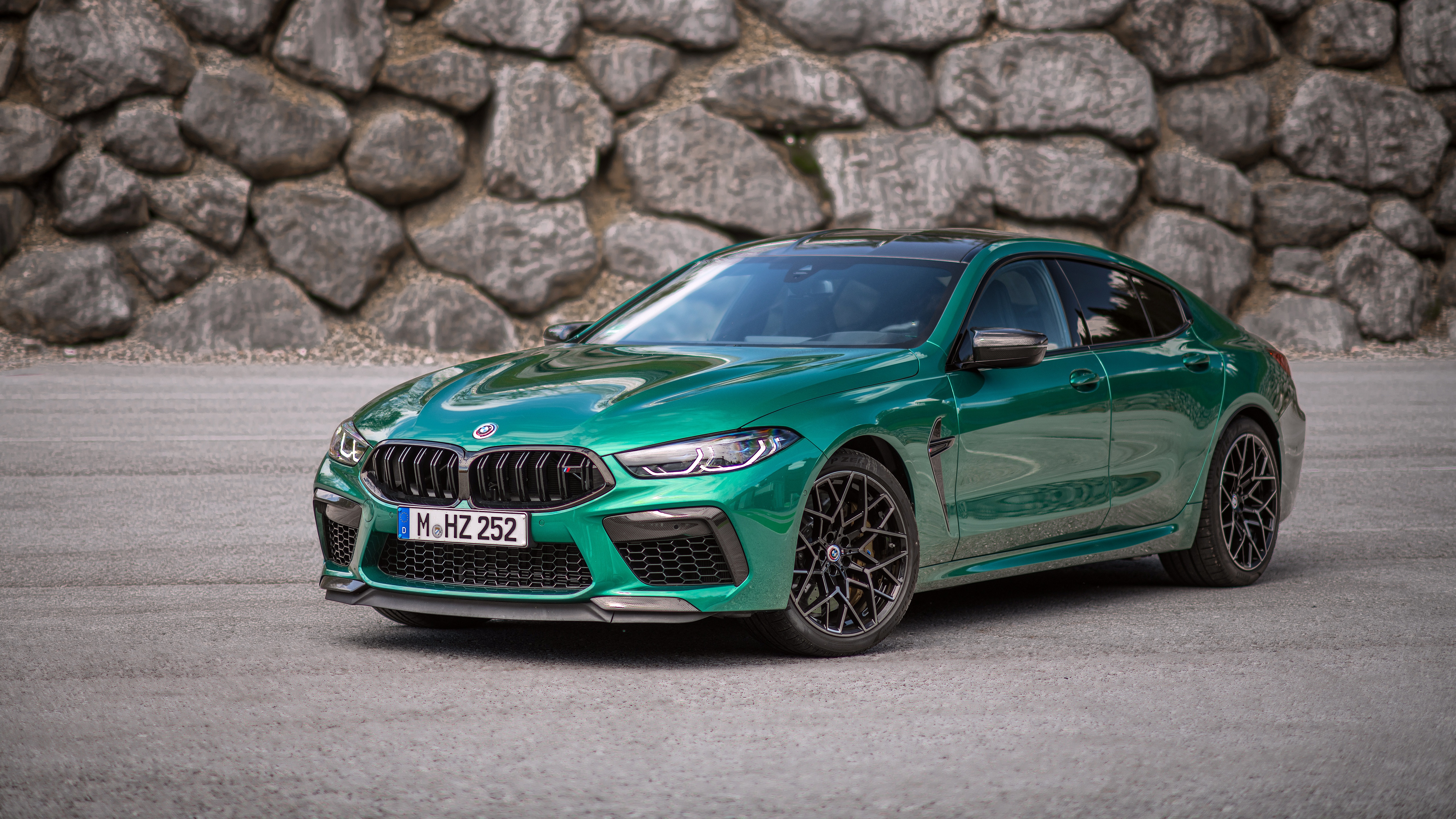 BMW M8 Competition Gran Coupe by a Stone Wall - backiee