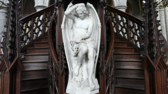 Fallen Angel Statue Enshrouded in Mystery wallpaper