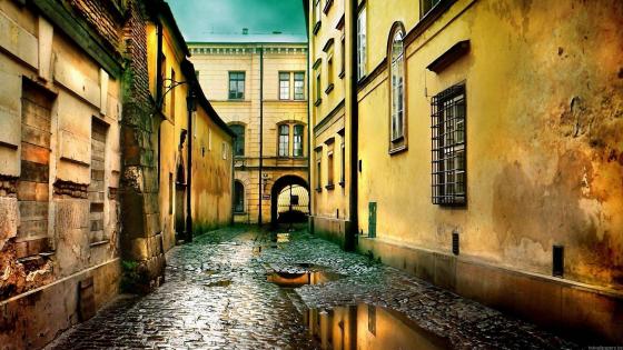 Misty Cobblestone Alley in an Empty City wallpaper