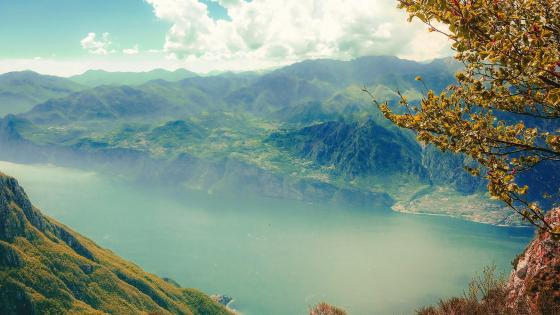 Breathtaking Mountain Valley Vista with Lake and Fog wallpaper