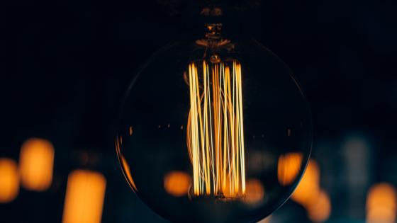 Warm Glow of Vintage Light Bulb Wallpaper wallpaper