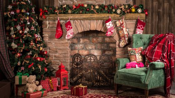 Cozy Christmas Hearth and Festive Decorations wallpaper