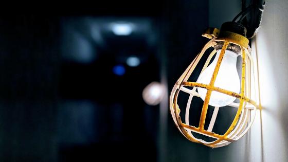 Radiant Lightbulb in Dim Environment wallpaper