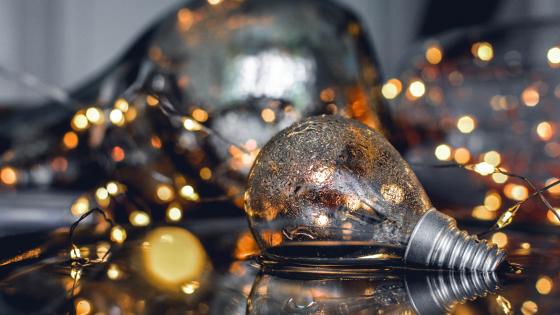 Illuminated Reflections of a Glass Lightbulb wallpaper