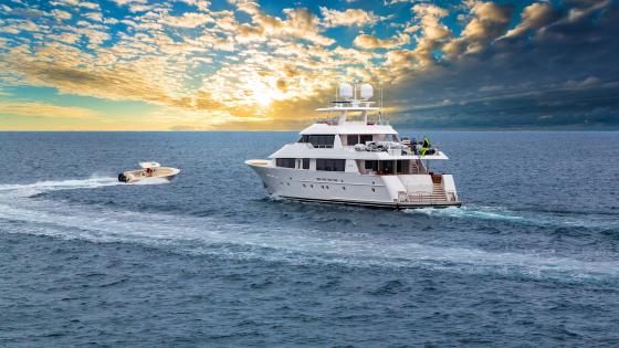 Luxury Yacht Sailing into the Sunset wallpaper