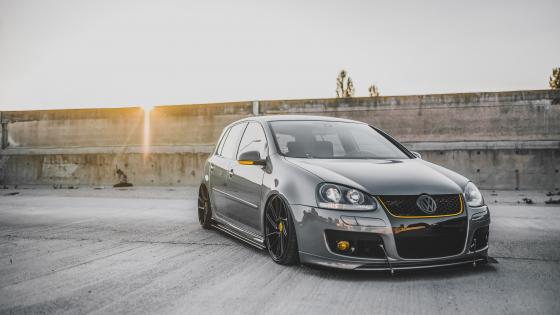 Sunset Gleam on Sleek Vehicle wallpaper