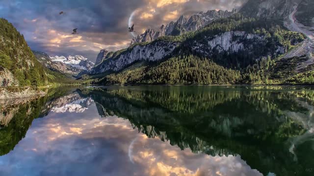 Mountain lake reflecting dramatic clouds live wallpaper