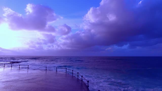 Calm ocean horizon under dramatic cloudy sky live wallpaper