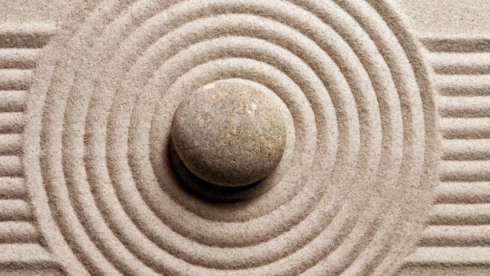 Zen stone in the sand ☯️ wallpaper