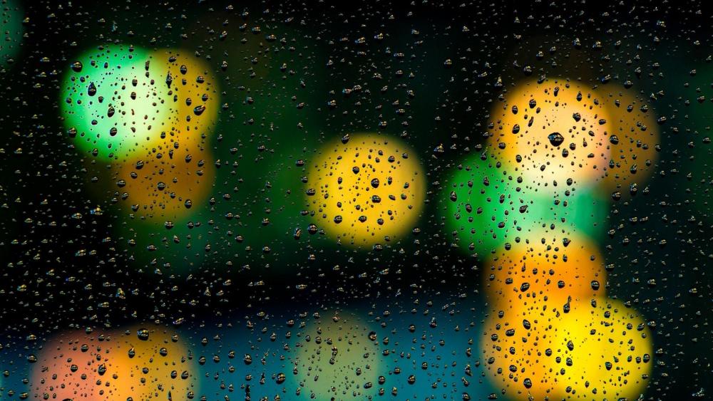 Raindrops on the window with bokeh lights wallpaper
