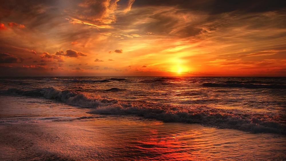 Glorious red and orange sunset at the North Sea wallpaper
