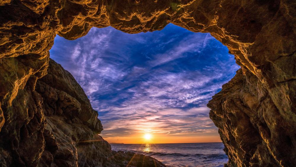 Sunset from a sea cave wallpaper