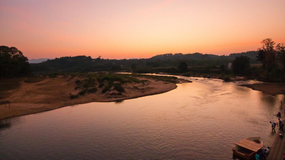 Sunset Over a Forest River wallpaper