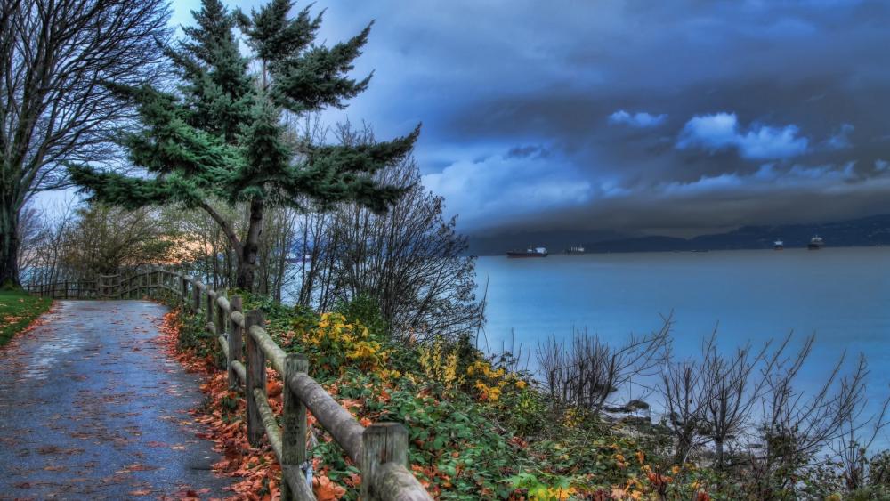 Cloudy autumn castline walkway wallpaper