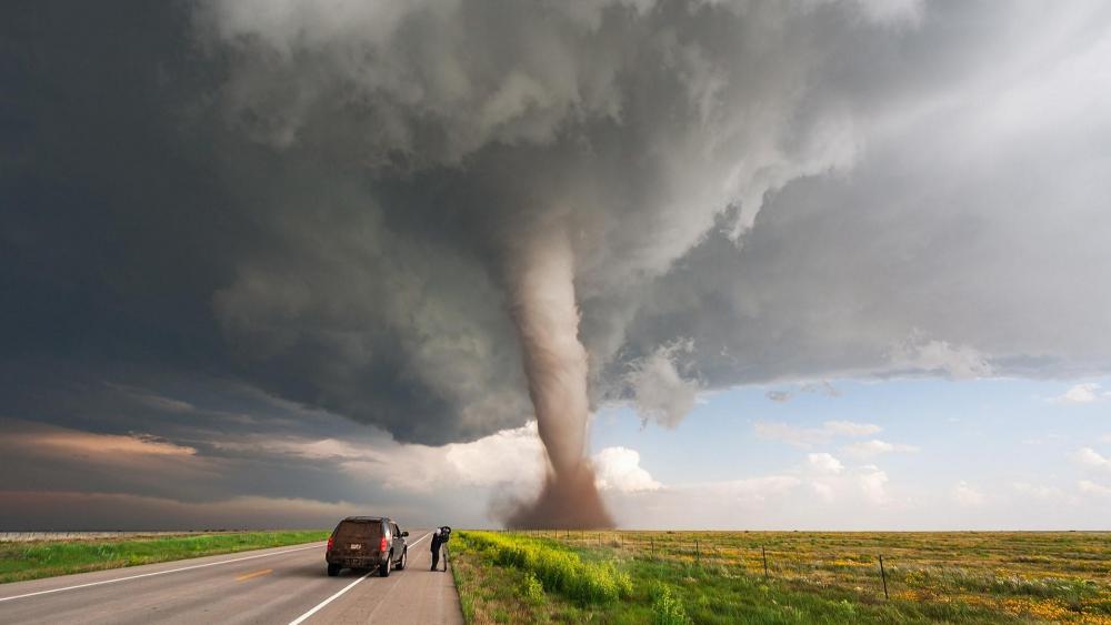 Tornado and a daring storm chaser wallpaper