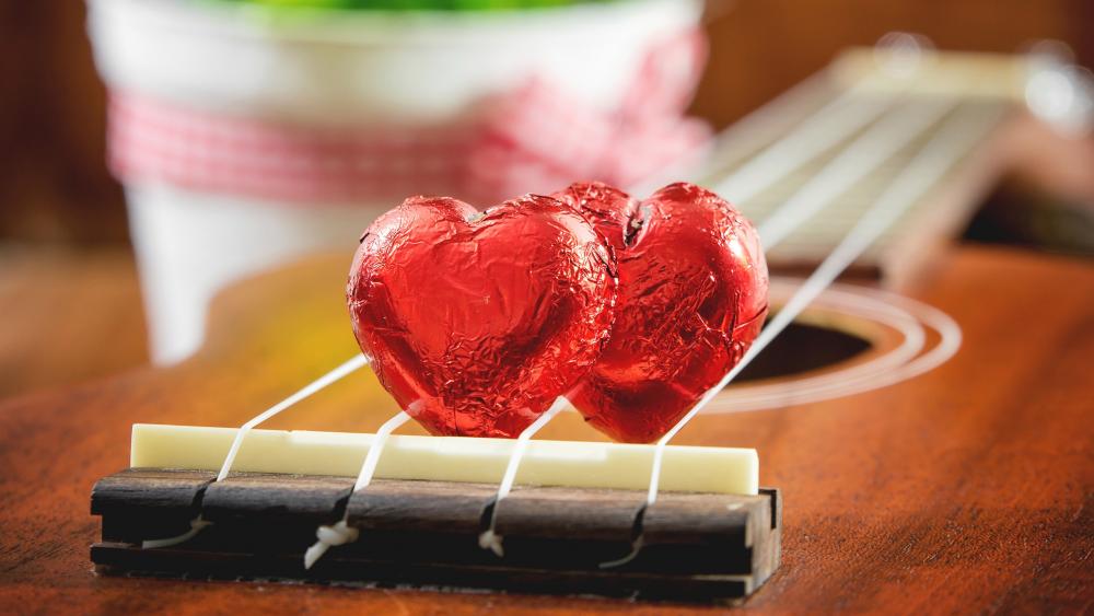 Hearts on a guitar wallpaper