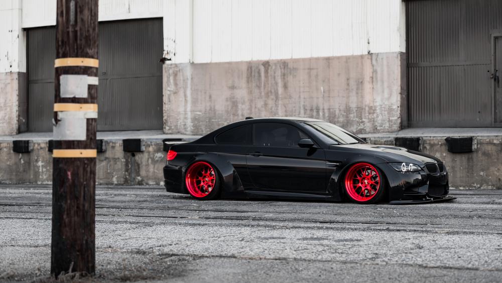 Black BMW M3 with red rim wallpaper