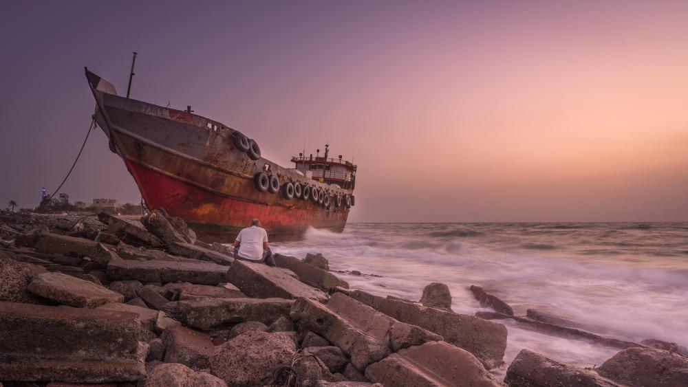 Rusty ship on the shore wallpaper