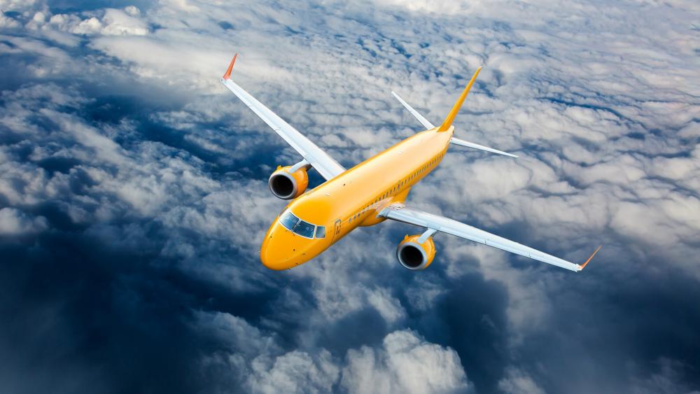 Yellow airbus above the clouds wallpaper