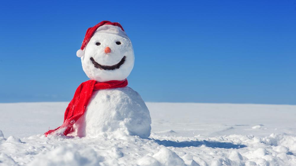Smiling snowman dressed as a Santa Claus wallpaper