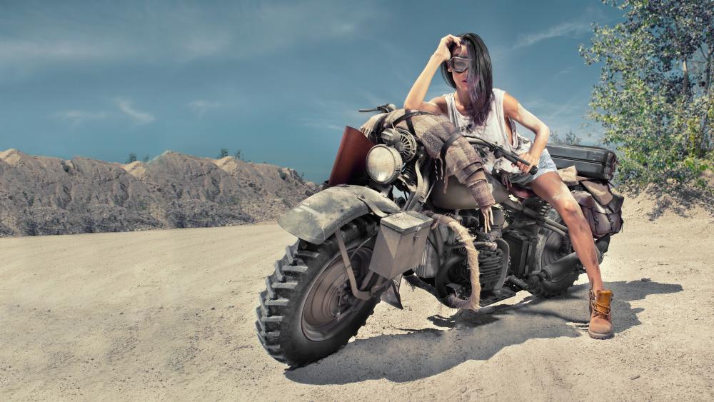 Sexy biker woman on the desert wallpaper