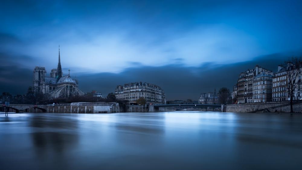 The Notre Dame De Paris and the Seine River wallpaper