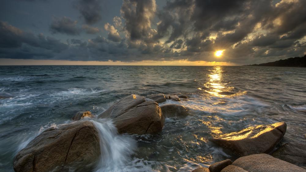 Boulders on the shore wallpaper