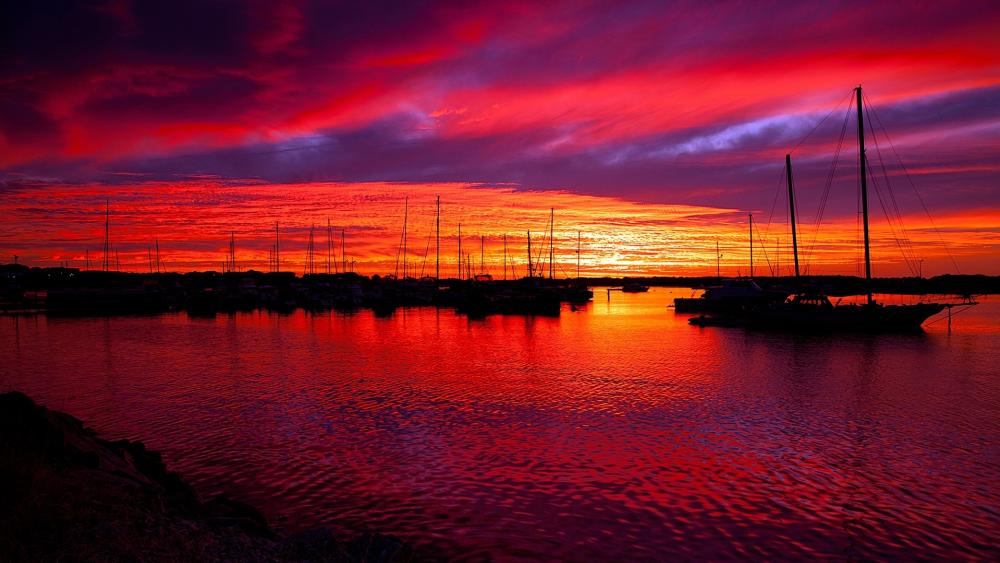 Sailboats in the horbor in the sunset wallpaper