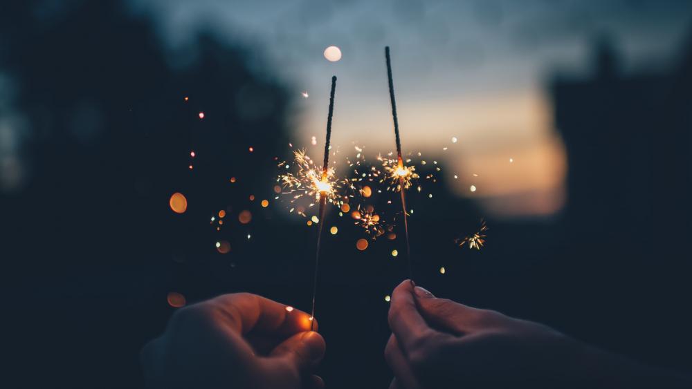 Hands with sparklers wallpaper