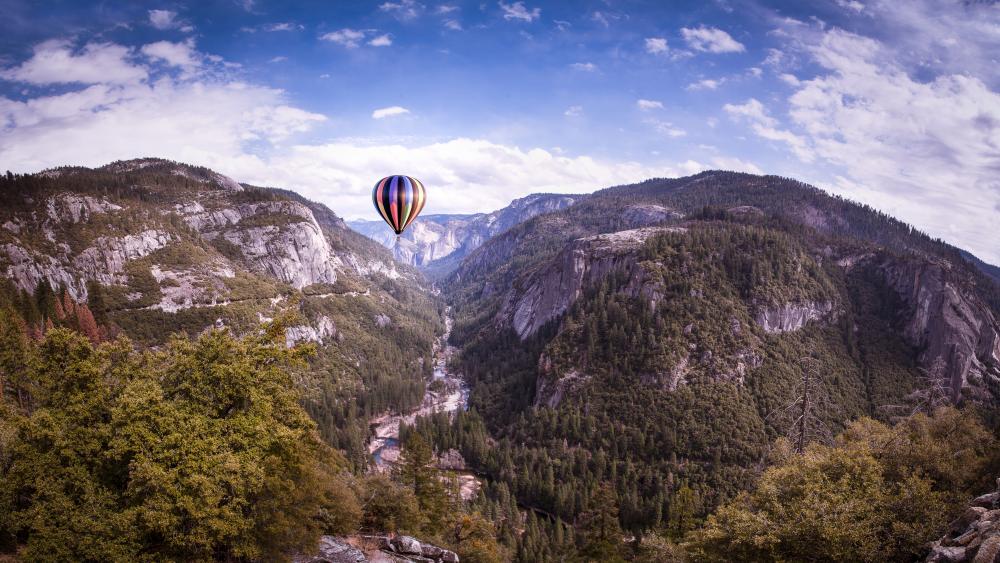 Hot air balloon flying over Yosemite wallpaper