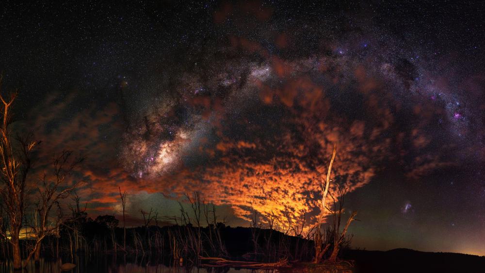 Starry Night Cascade Over Burnished Horizon wallpaper