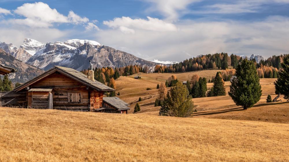Wooden house in the Dolomite Mountains wallpaper