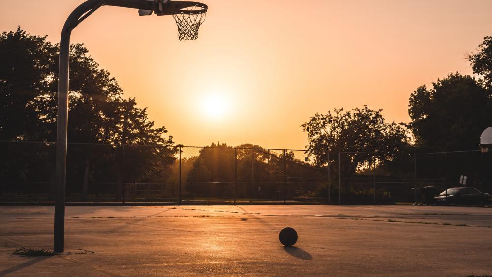 Basketball and hoop with sunrise wallpaper