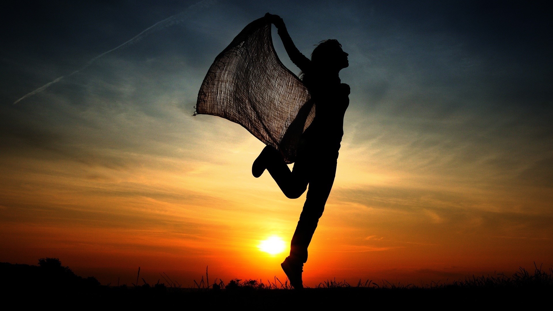 Dancing woman silhouette in the sunset - backiee