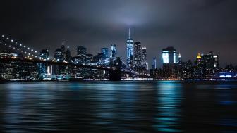 The Brooklyn Bridge and the Empire State Building at night wallpaper